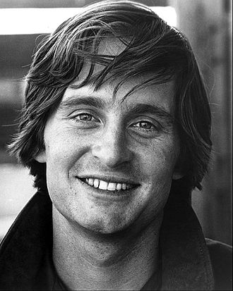 A black and white photograph of Michael Douglas in 1969