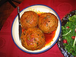 Three eight-inch meatballs in sauce