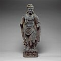 Tik turgan bodhisattva, ehtimol, Maitreya, Gandhara.