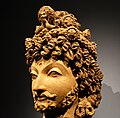 Gandhara haykali, bodhisattva boshi.