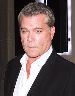 A 59-year-old man looking at the camera