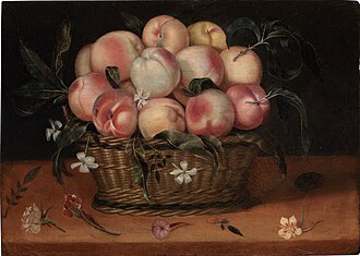Wicker basket with peaches, jasmine flowers, rose and carnation