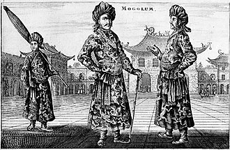 A black-and-white print depicting three standing men wearing turbans, a long robe with a sash, and shoes with rising pointed tips, against an architectural background of buildings with roofs that point upwards. The man on the left, slightly in the background, is carrying a long folded umbrella on his left shoulder. The one in the center, who faces the viewer, is resting on a cane. The man on the right, seen in profile view, faces the center man.