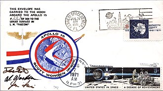 A rectangle with the headline "An Apollo 15 Flown Lunar Postal Cover" with a logo in the middle. Below it are two smaller frames. One has some text certifying that what was below was flown to the Moon and back, signed by flight commander David Scott. Below it is an envelope with stamps, logos and, postmarks.